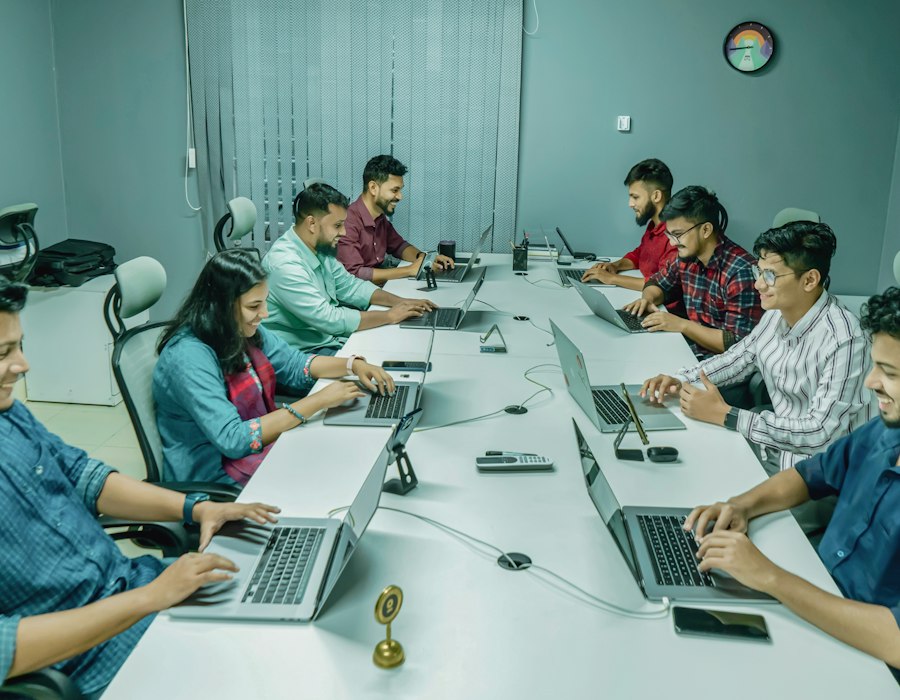 Dwitech team members working at their desks in the company office